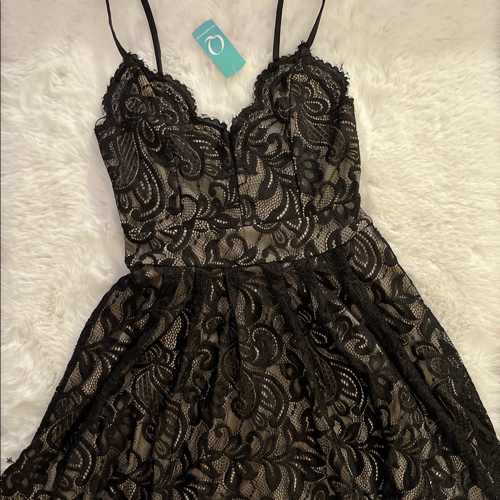 Flowy, flowery black and cream dress. Never worn, new with tags.